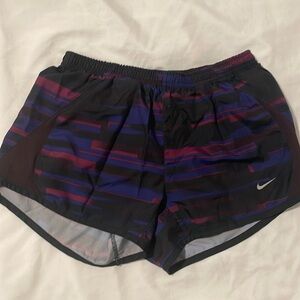 Purple, blue and black nike shorts.